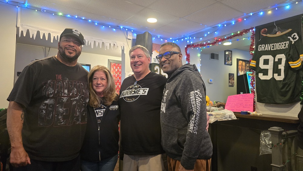 Dave and Tammy Burns with Gilbert Brown and Andre Rison